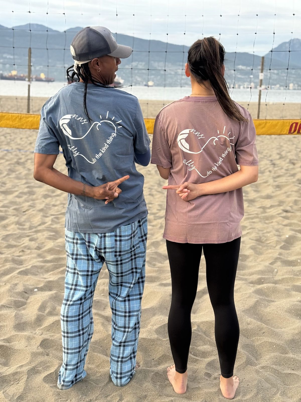 Players at Spanish Banks wearing the ALLY x NNS Do The Kind Thing Tee