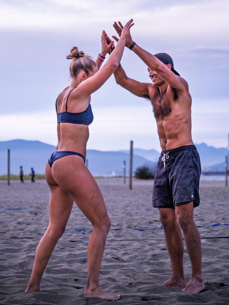 Teammates high-fiving between points