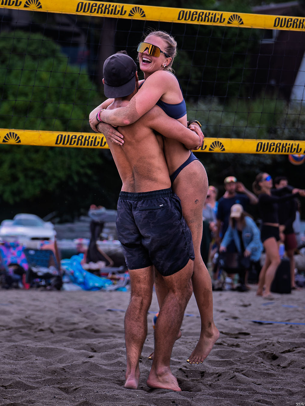 Two teammates hugging after winning a point